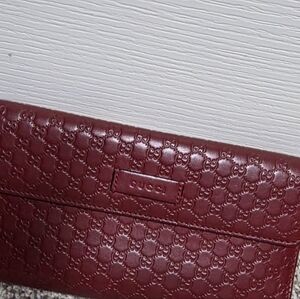Gucci Burgundy Embossed Leather Clutch